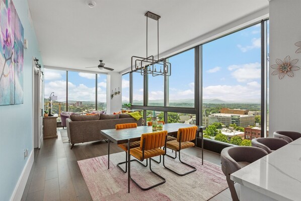 Living, dining room with breakfast bar seating 3