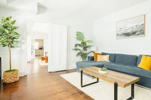 First floor spacious living room with TV