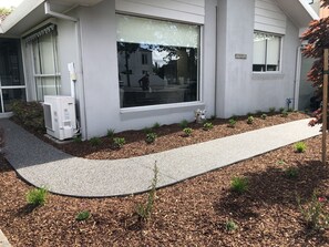 Front of apartment to front door.
