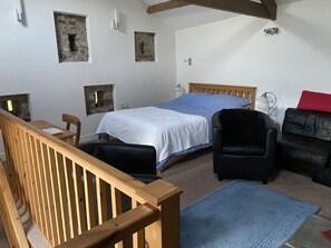 Upstairs open plan studio living and sleeping area