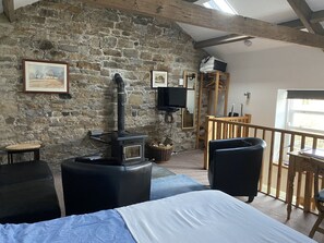 Upstairs open plan studio living and sleeping area
