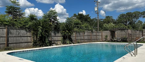 Enjoy the pool behind the 8ft tall privacy fence. 
