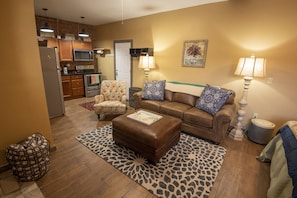 Relax in living room suite adjoining kitchen