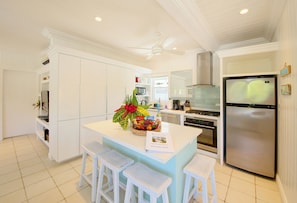 Newly refitted kitchen with kitchen island with countertop seating