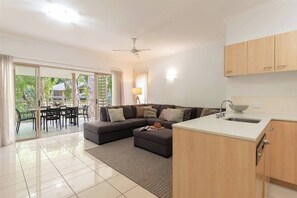 Enjoy seamless entertaining in the air-conditioned open-plan living and kitchen area that flows out to the balcony