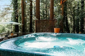 Soak your cares away in the hot tub - among the trees.