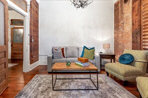 living room with fold out couch and flat screen TV with You Tube TV.