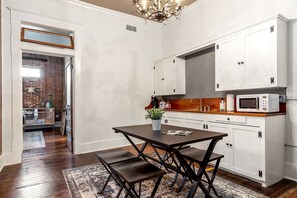 The kitchen which includes a mini fridge, microwave and coffee maker.