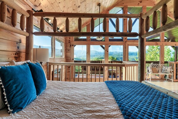 Upstairs loft style bedroom with king size bed