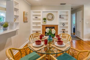 An optional dining, work or game space is accented by a quaint fireplace.