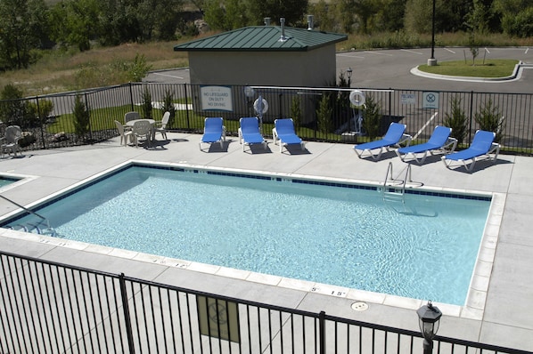Lounge by the pool in the sunshine.