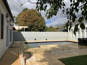 Large secure pool separates the main house from the Guesthouse.