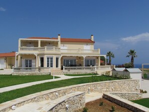 The rear of the house that looks over the sea taken from the beach viewing area