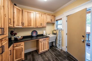 Downstairs laundry room entry to home