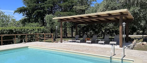 Enjoy relaxing by the pool under the huge gazebo.