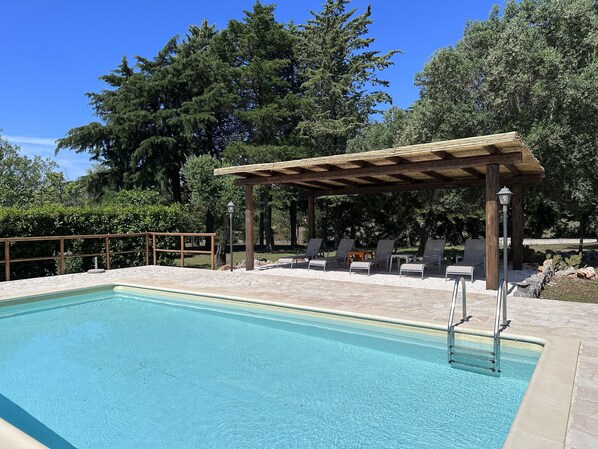 Enjoy relaxing by the pool under the huge gazebo.