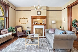 The bright living room with a stylish chesterfield lounge filling the room