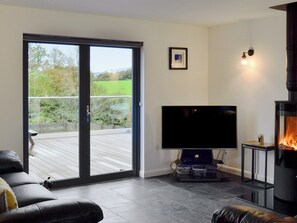 Comfortable living area with cosy wood burner | Thistlebank, Banton, near Kilsyth