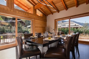 Large dining table inside and on the terrace