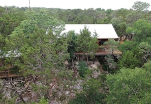 View of the Cabin, Porch, BBQ Station & Lookout from across the Creek Bed.