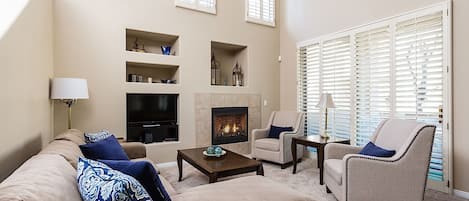 Bright open living room with vaulted ceilings