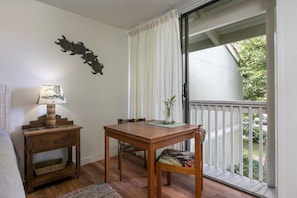 Small table for your use which overlooks the lovely leafy tree views. This is also a great little work space if you work remotely