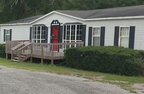 home front view and red door guest entry