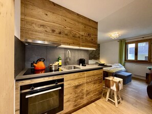 Wood, Interior Design, Countertop, Kitchen, Cabinetry, Ceiling, Sink, Wood Stain, Home Appliance, Hardwood