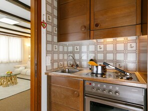 Cabinetry, Countertop, Building, Property, Furniture, Tap, Kitchen Stove, Kitchen Appliance, Kitchen, Wood