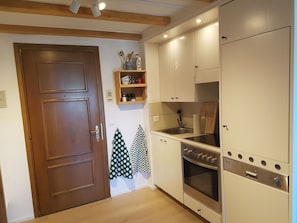 Cabinetry, Countertop, Wood, Door, Interior Design, Kitchen, Floor, Kitchen Stove, Flooring, Home Appliance
