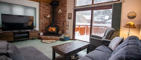 Living Area with Large Windows, Forested Views, Smart TV & Woodburning Fireplace with free wood!