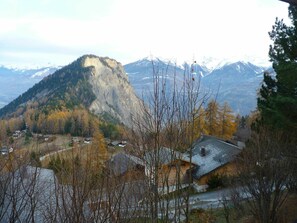 Mountain, Sky, Cloud, Plant, Ecoregion, Tree, Snow, Natural Landscape, Larch, Branch