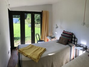 One of the twin beds in new garden extension, overlooking fields.