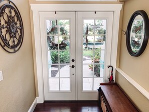 Front entrance.  The main living area features beautiful dark hardwood floors.