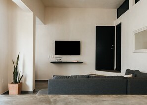 Find peace and relaxation with your close friends and family in this stunning living room featuring chic decor.