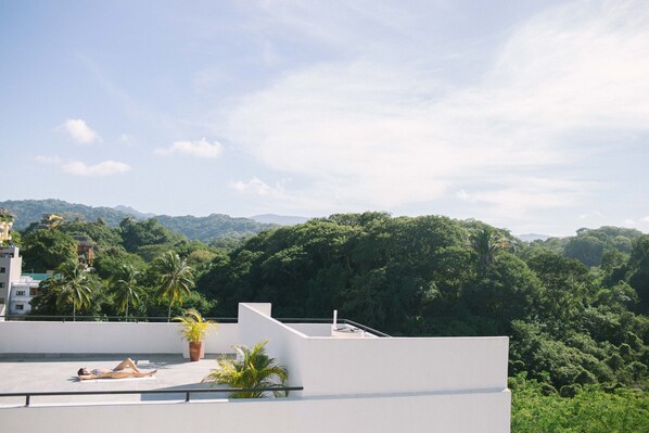 Bask in the sun on our Shared Rooftop patio