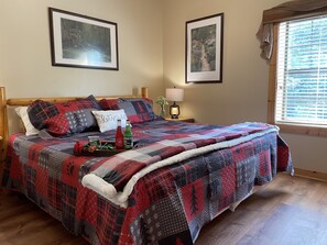 Sweet dreams in the luxurious king-size bedroom of this cozy cabin.