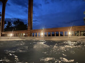 Covered deck, providing the perfect space to enjoy the hot tub in any weather.