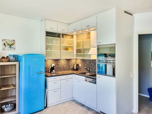 Cabinetry, Property, Countertop, Furniture, Blue, Kitchen, Wood, Floor, Flooring, Sink