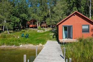 View from the private dock. Bunkhouse on the right, with cabin up the slope.