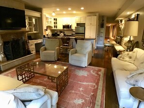 Open floor plan: living room, dining area, kitchen. Queen sleeper