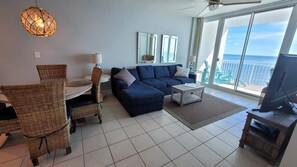 Dining room table and living room view through balcony door to Gulf of Mexico 