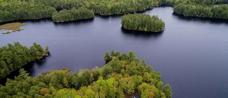 Aerial view of property and lake.