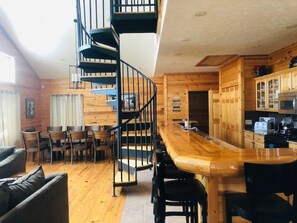 Interior of cabin with sprial stairs that lead to the 2 upstairs bedrooms