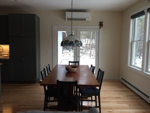 Handmade dining room table looking out to french doors