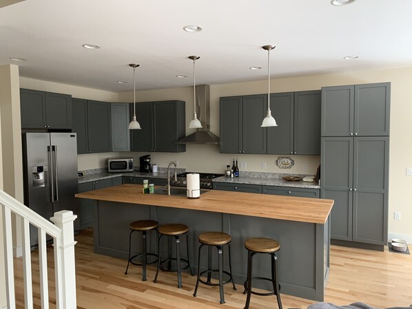 10 foot long butcher block counter and sitting area.