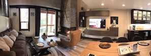 Living room area features plenty of entertaining space by the gas fire.