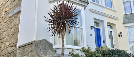 The outside of the house on the corner of Bowling Green.