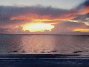 Sunset from our 9th floor screened balcony.