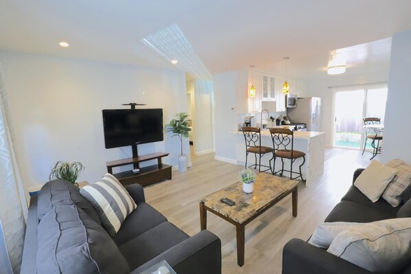 Relax in the comfort of this living room after a day at the Beach. Permit #str14-0085 